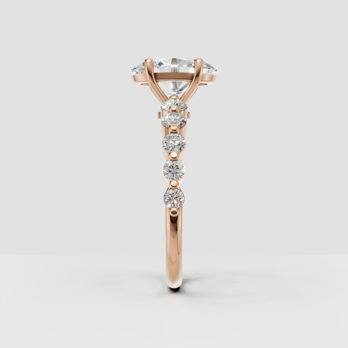 Luxury oval cut diamond ring with round diamonds across the upper shank