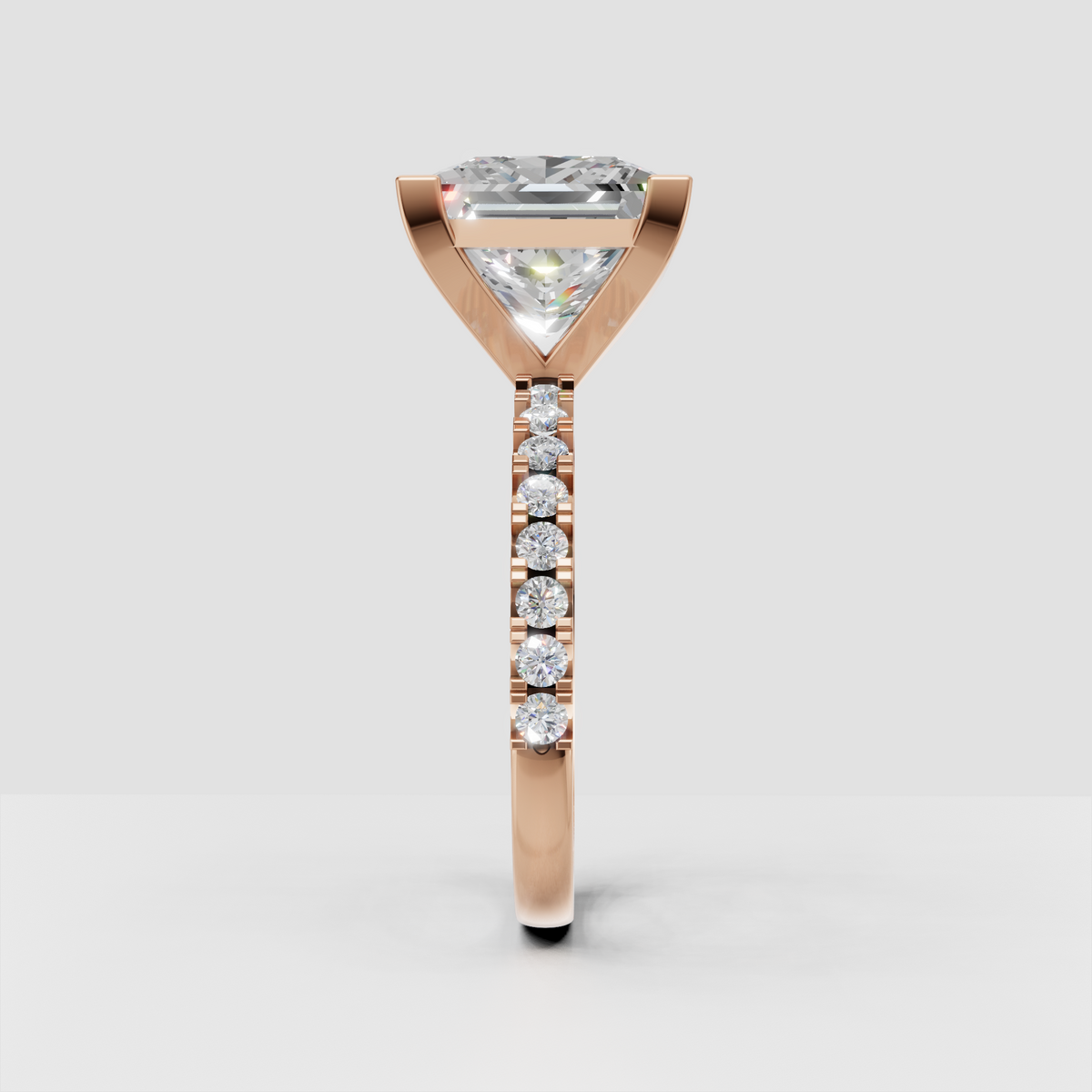 Square prong princess diamond ring with round accent stones