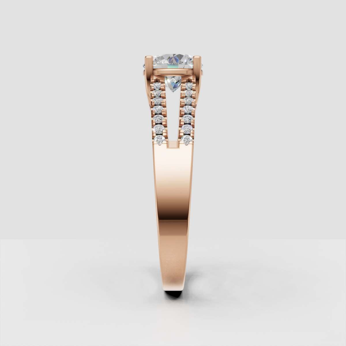 Side profile of yellow gold round Diamond engagement ring with open gallery