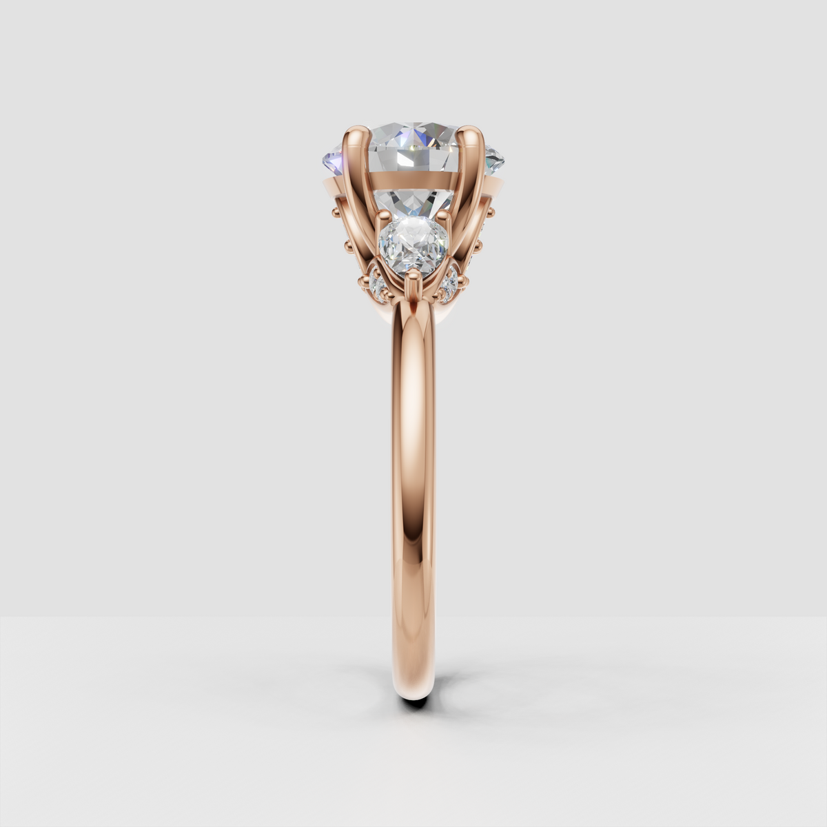 Botanical three-stone diamond ring with pear-shaped accents