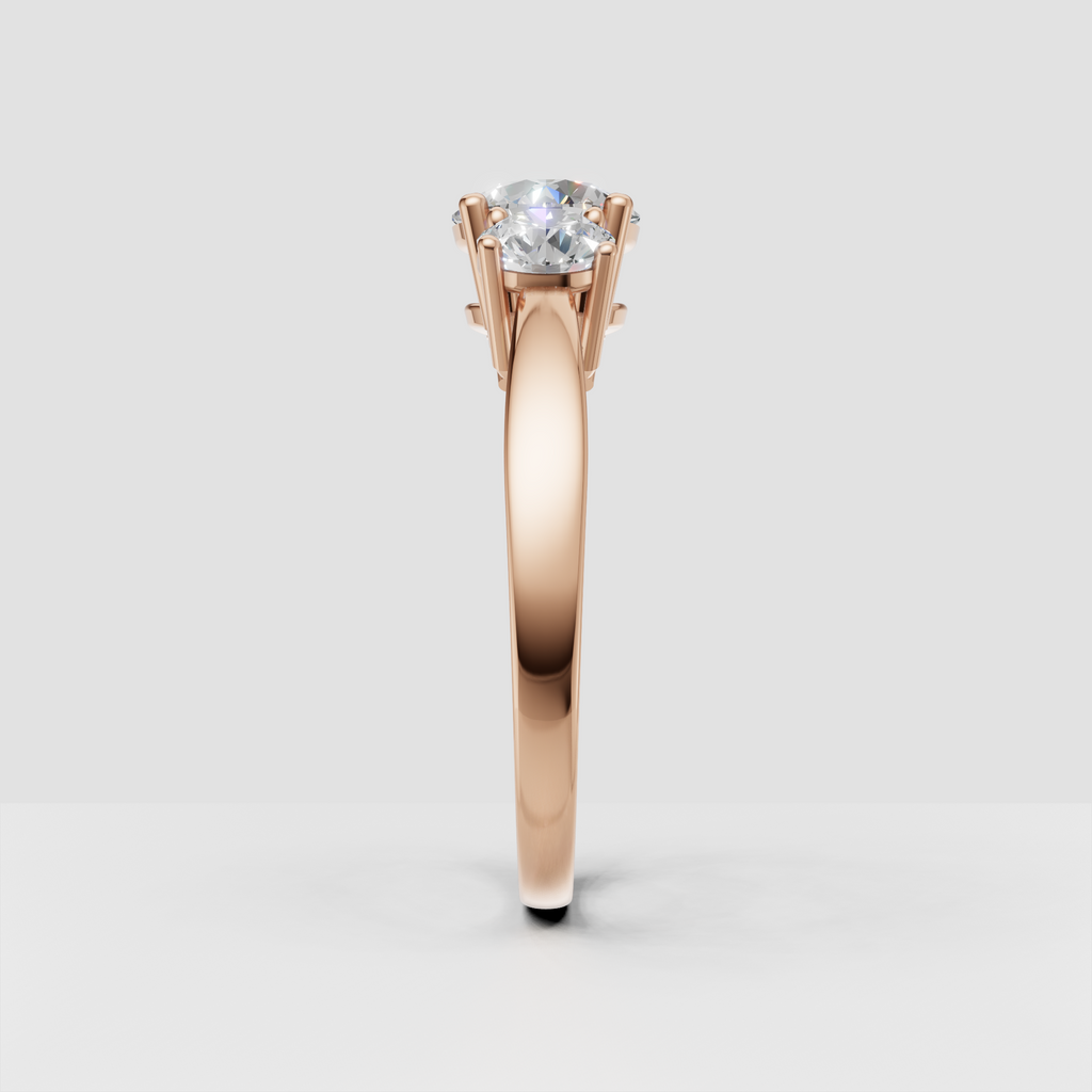 Detailed round Diamond three-stone ring with polished gold craftsmanship