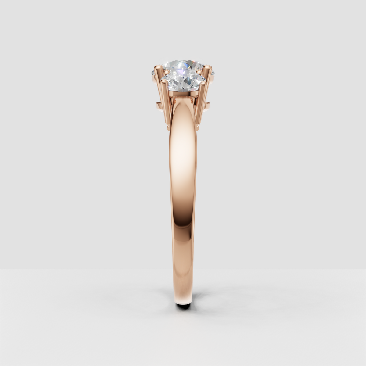 Detailed round Diamond three-stone ring with polished gold craftsmanship