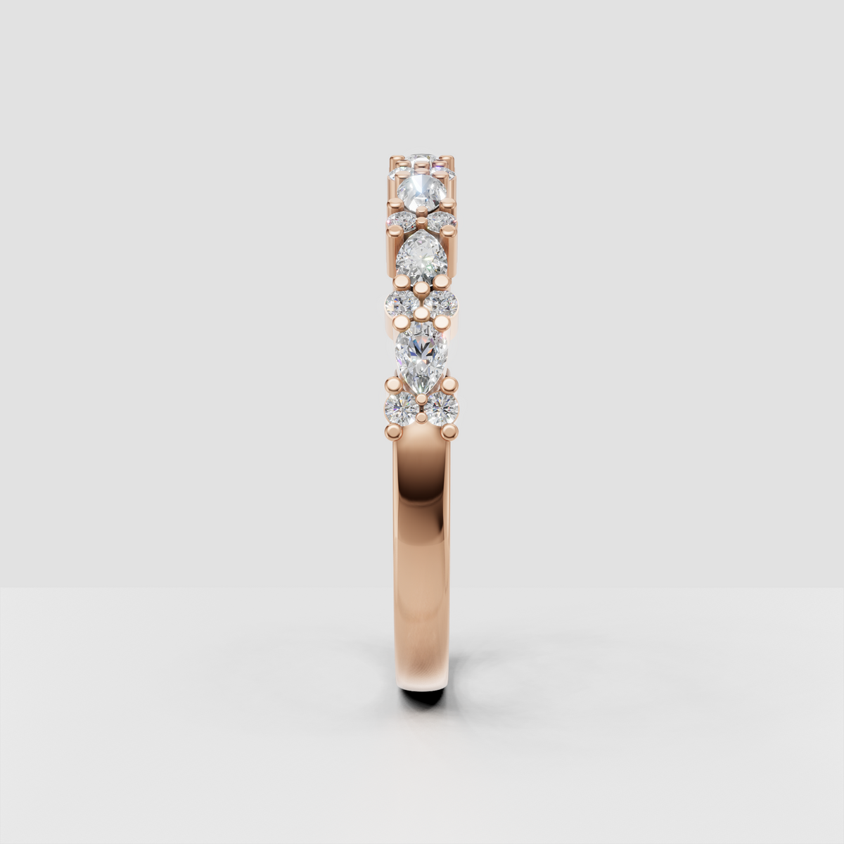 Pear and round diamond anniversary band