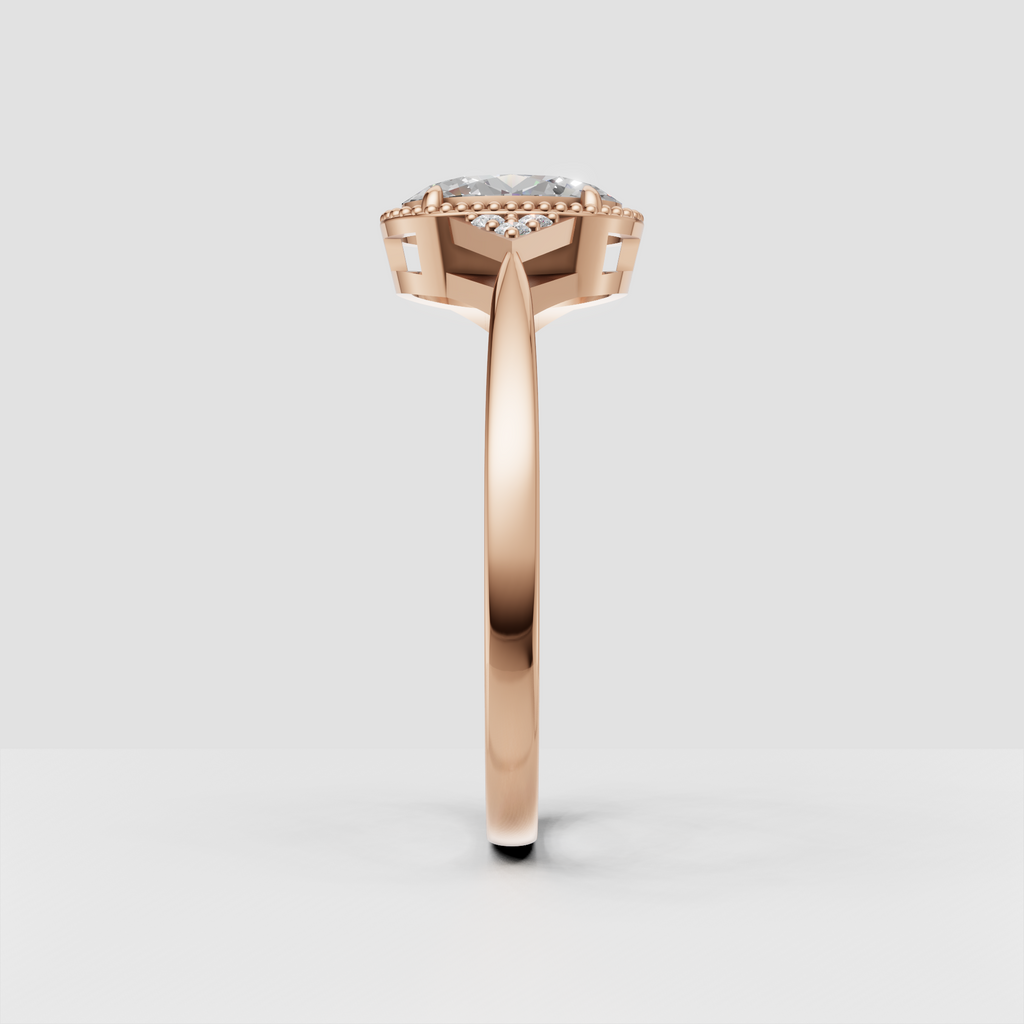 Oval center stone surrounded by delicate gold bead detailing