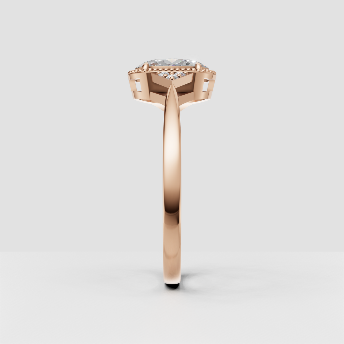 Oval center stone surrounded by delicate gold bead detailing