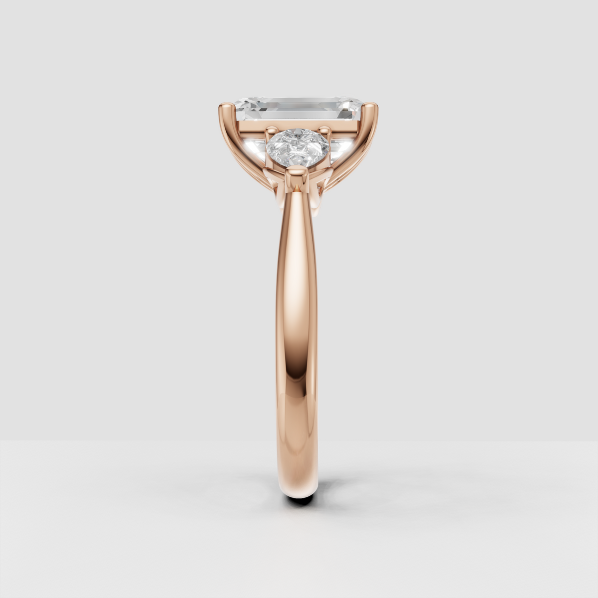 Emerald cut diamond three stone bridal ring