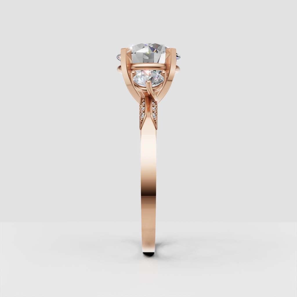 Contemporary three-stone round diamond ring with sculpted gallery