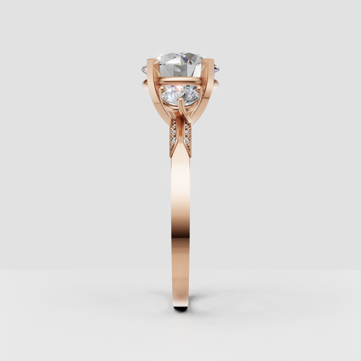 Contemporary three-stone round diamond ring with sculpted gallery