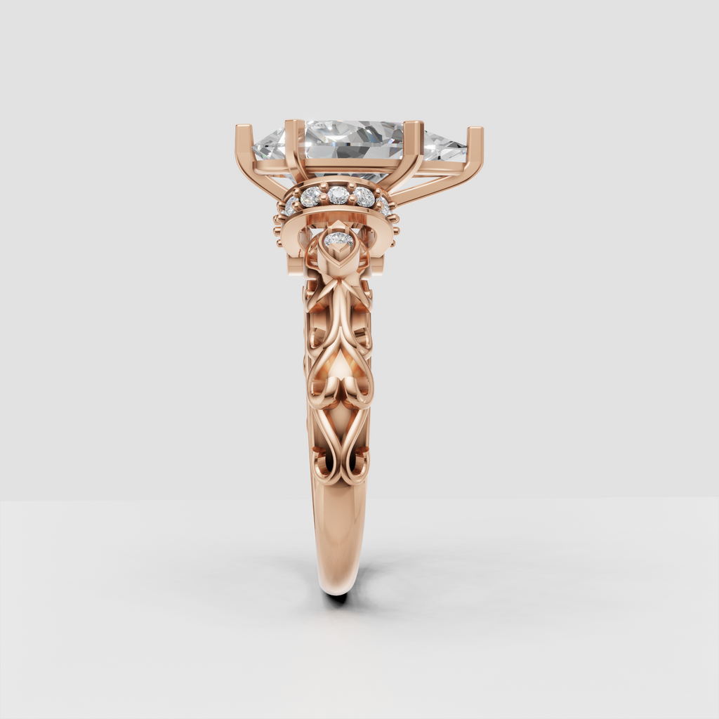 Vintage-inspired pear diamond engagement ring with ornate gold detailing