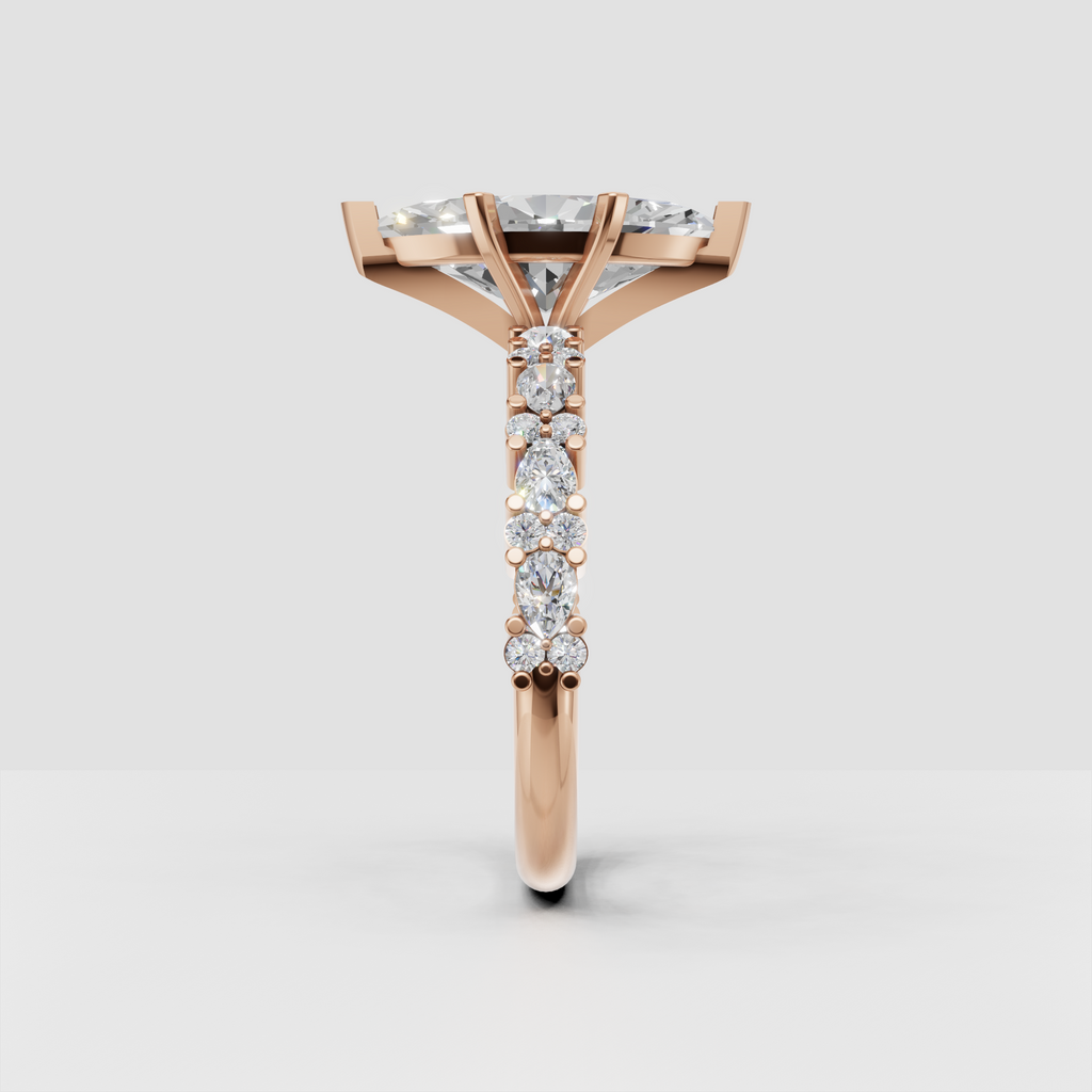 Marquise center diamond ring with accent stones and ornate yellow gold details
