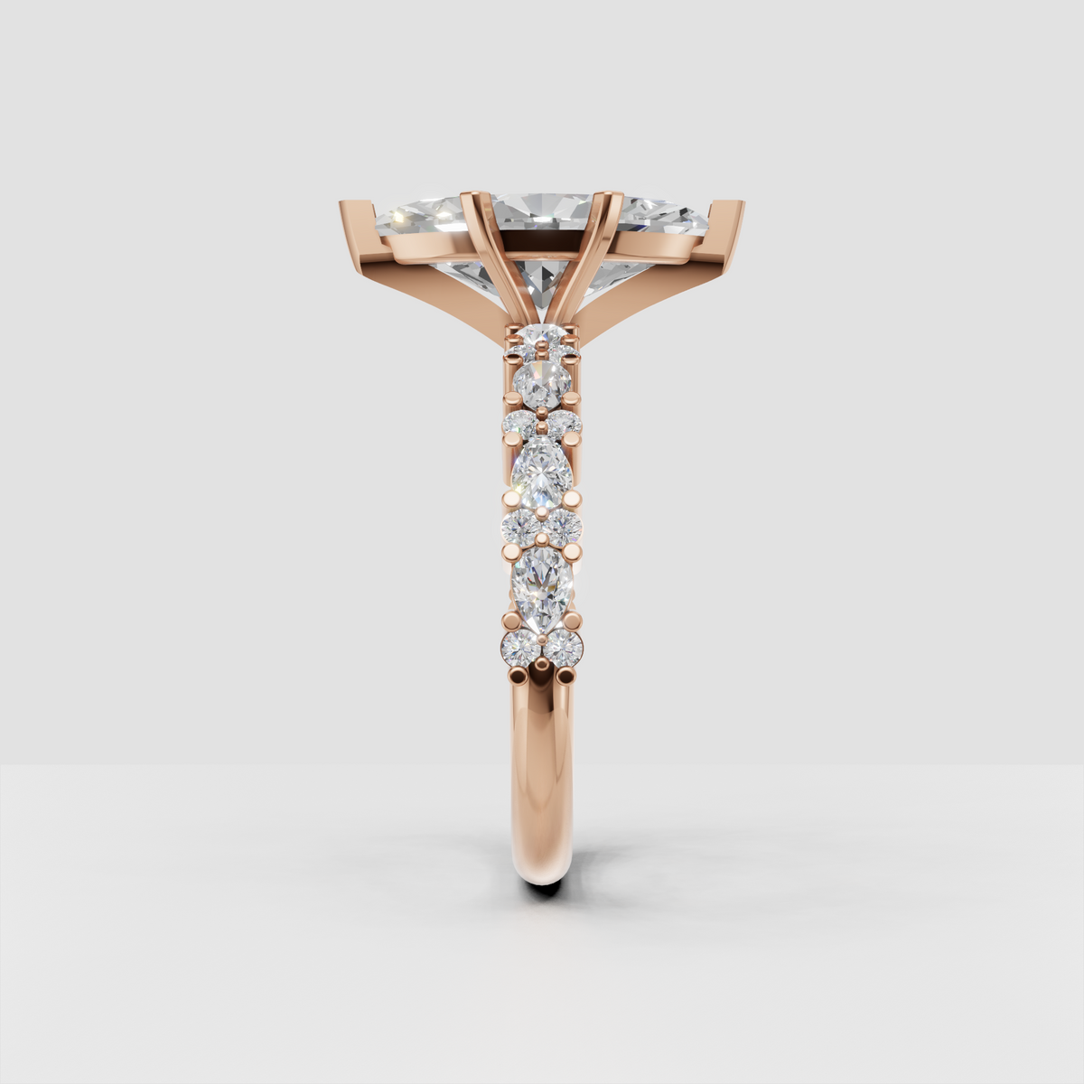 Marquise center diamond ring with accent stones and ornate yellow gold details