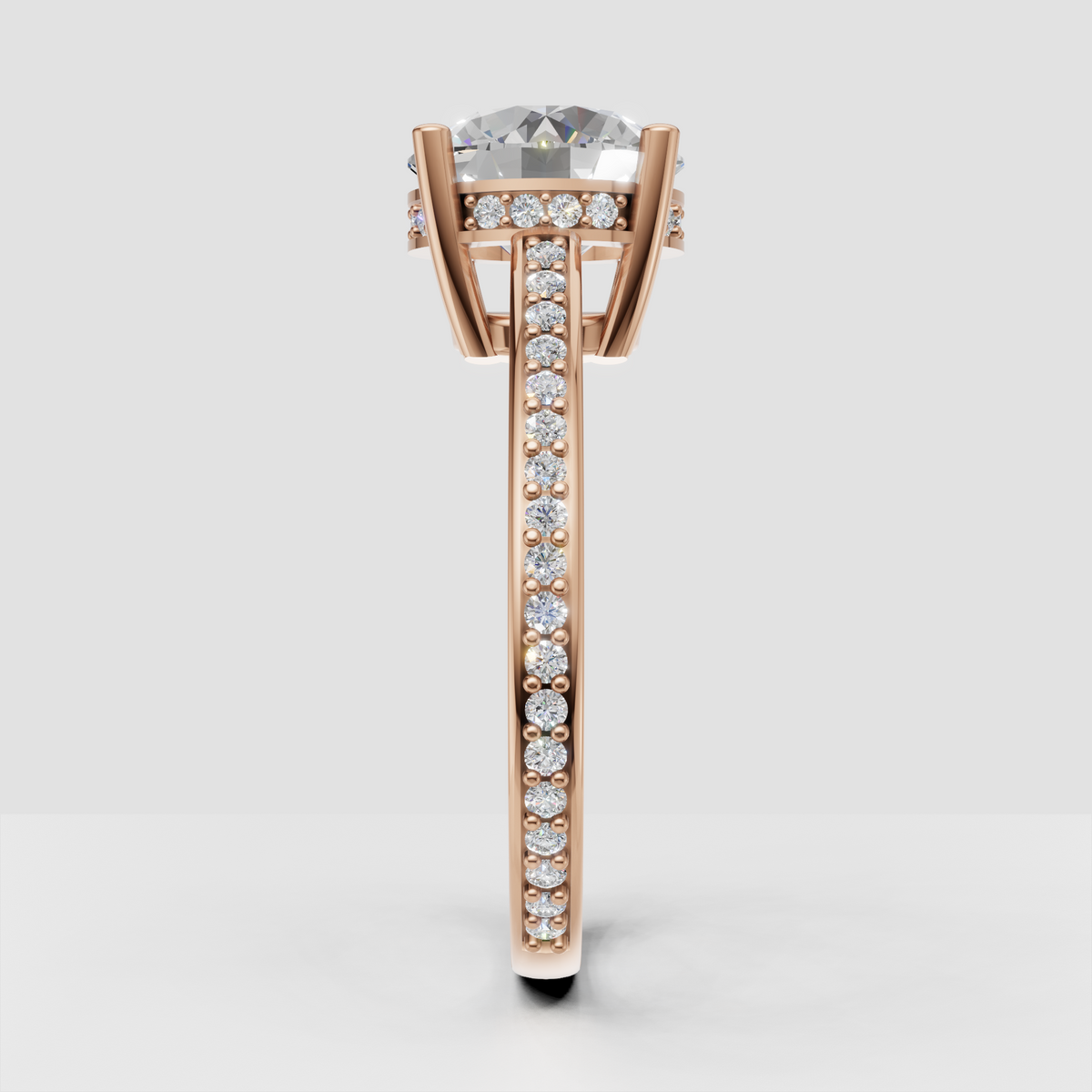 Round diamond ring with hidden halo and detailed pavé side stones.
