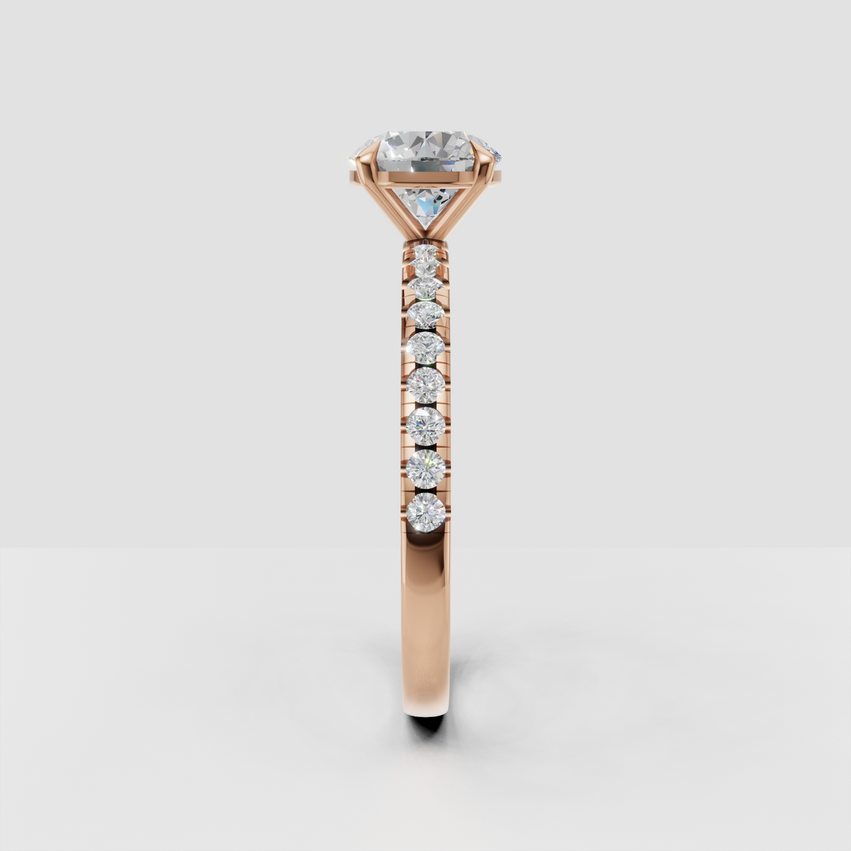 Side profile of yellow gold round Diamond engagement ring with basket-style gallery