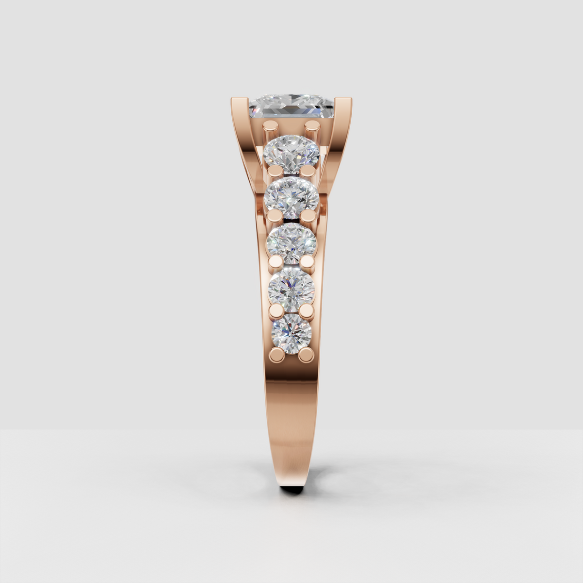 Square diamond engagement ring with graduated round stones on split shank band