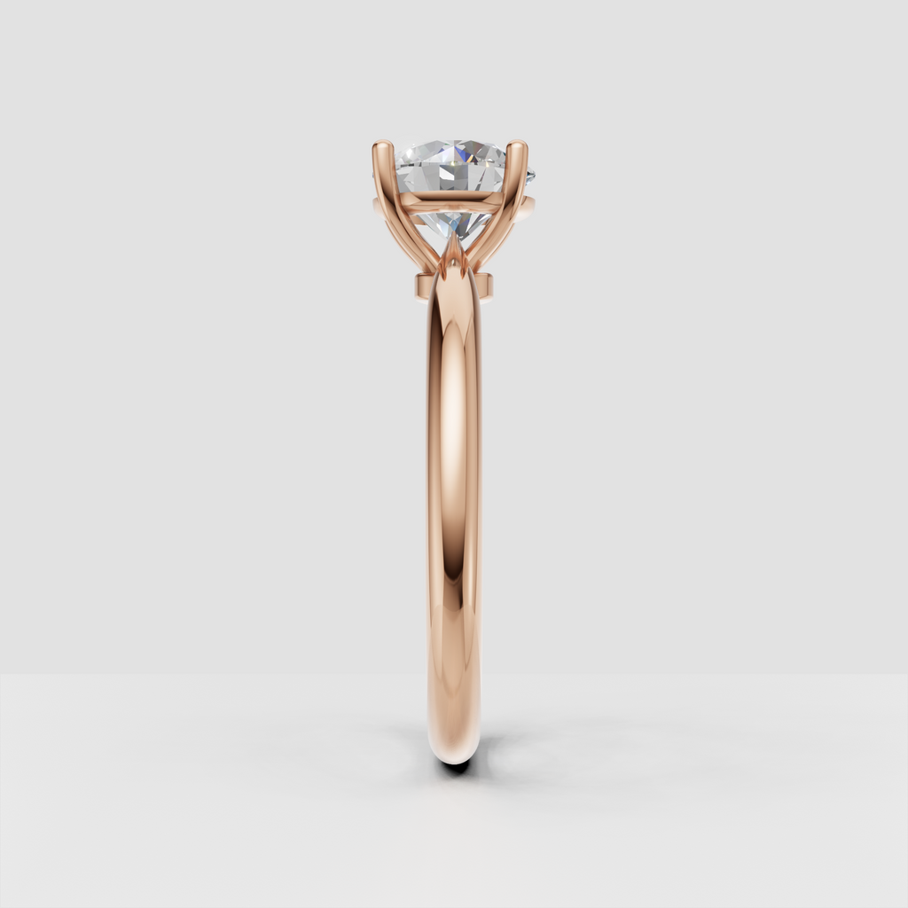 Polished yellow gold ring with round cut diamond solitaire center stone