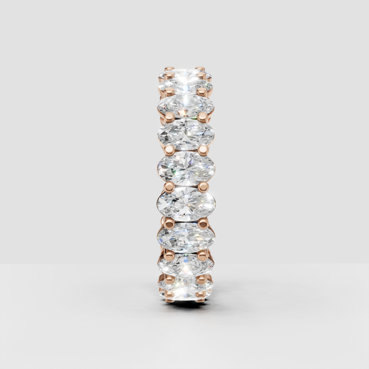 Oval diamond anniversary ring with four prong stone settings