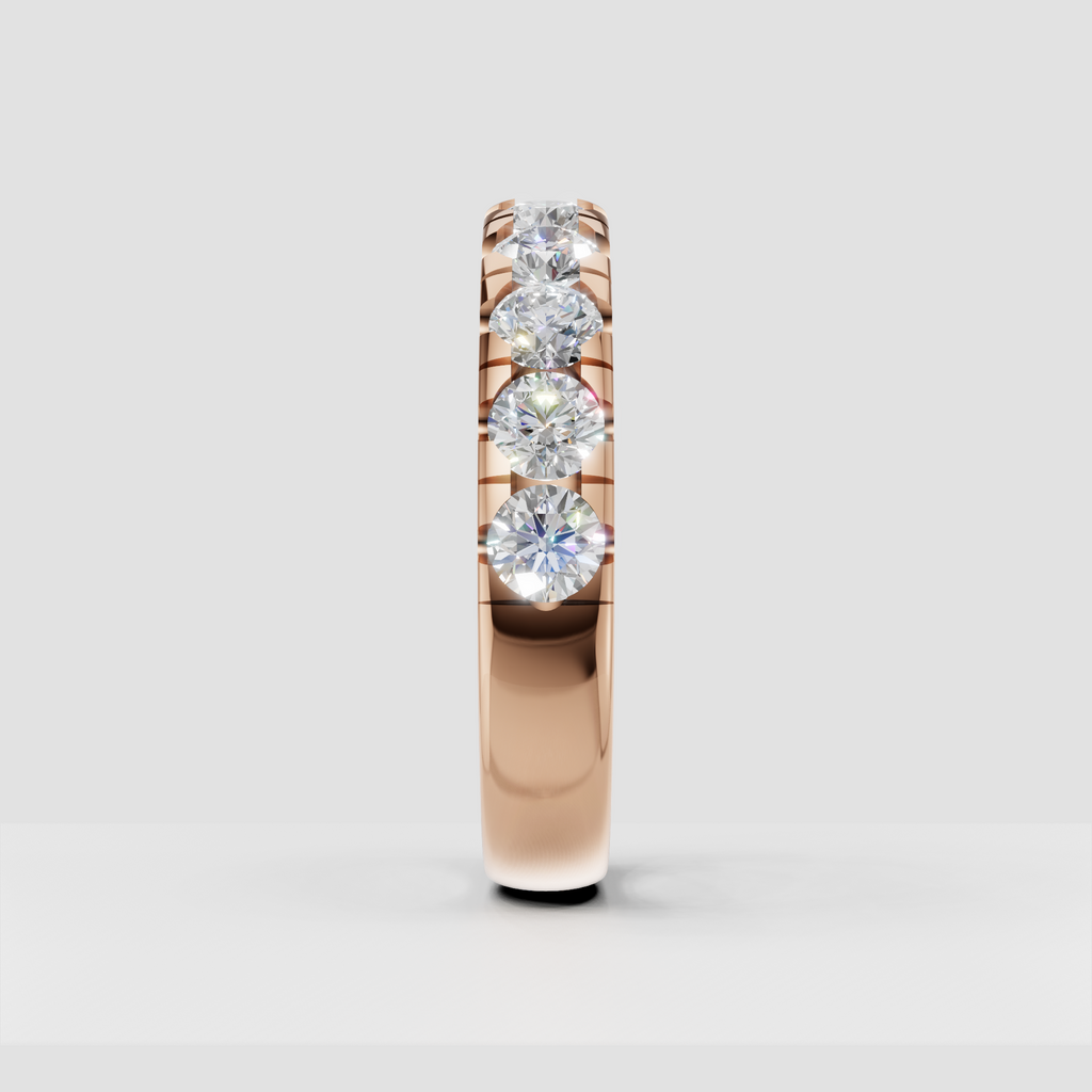 Side view of round diamond eternity ring showing open gallery construction