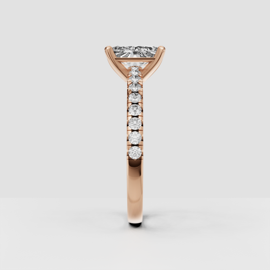 Detailed radiant Diamond engagement ring with four-prong yellow gold setting
