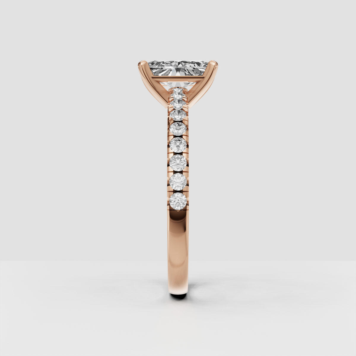 Detailed radiant Diamond engagement ring with four-prong yellow gold setting