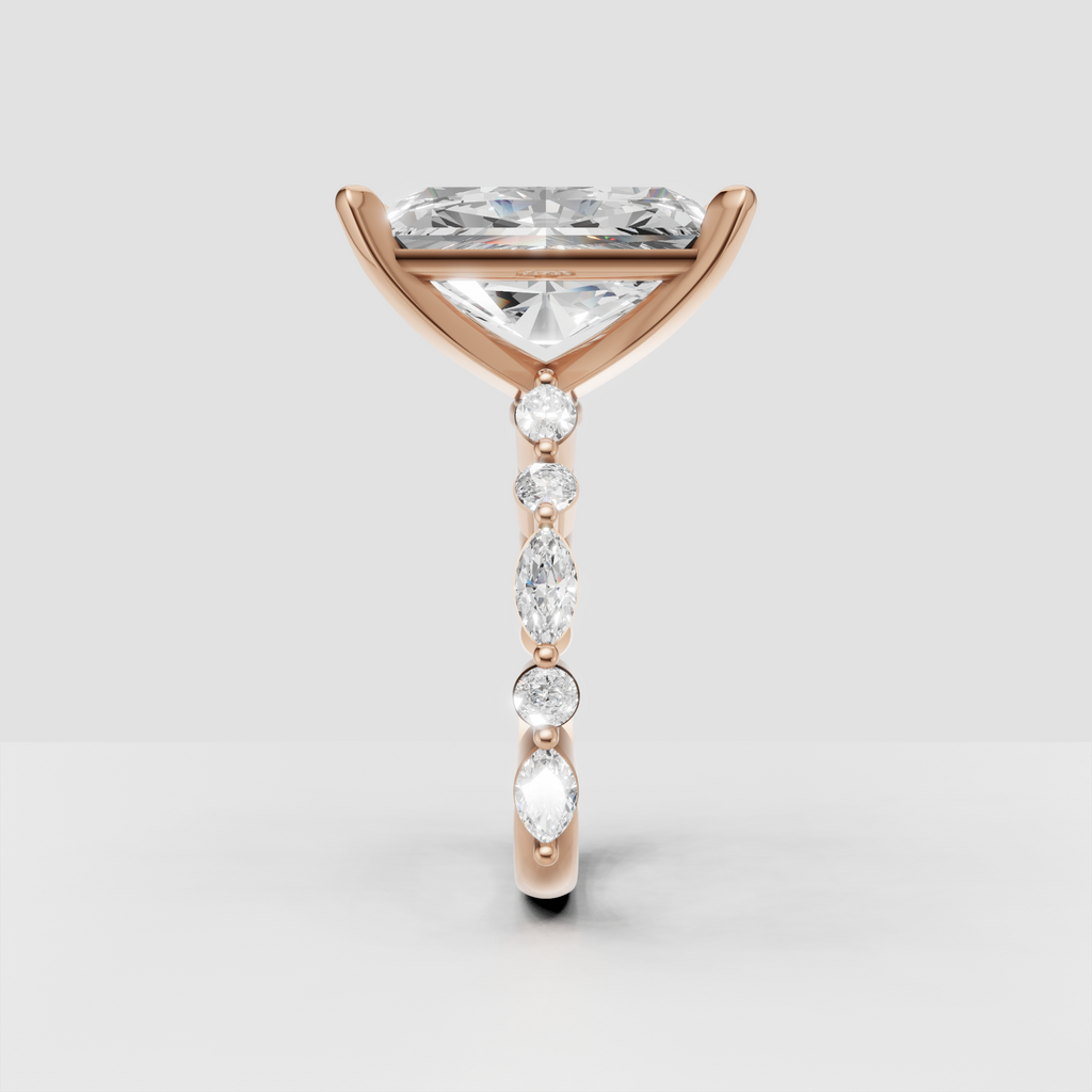 Yellow gold four-prong radiant diamond ring with intricate gallery detail