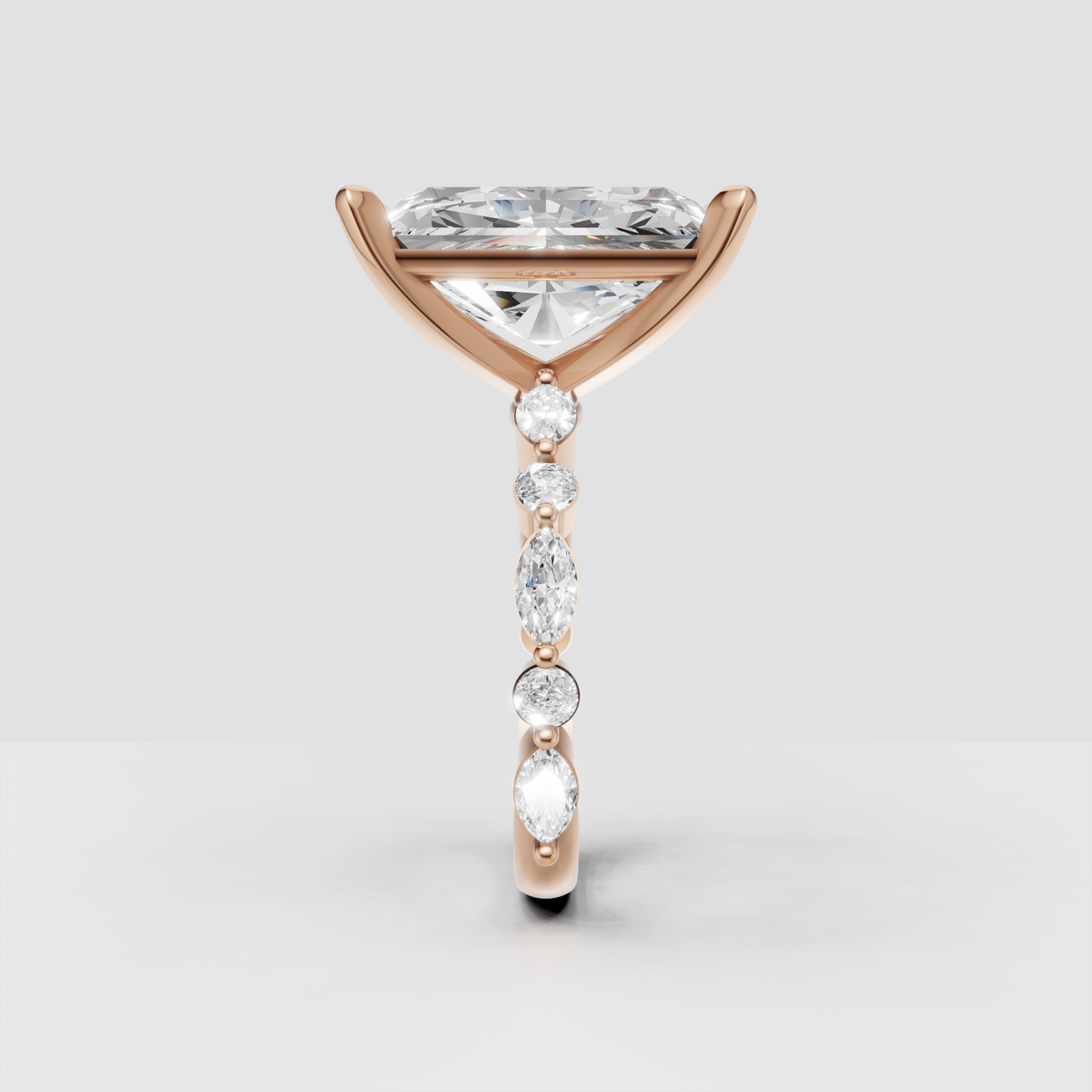 Yellow gold four-prong radiant diamond ring with intricate gallery detail