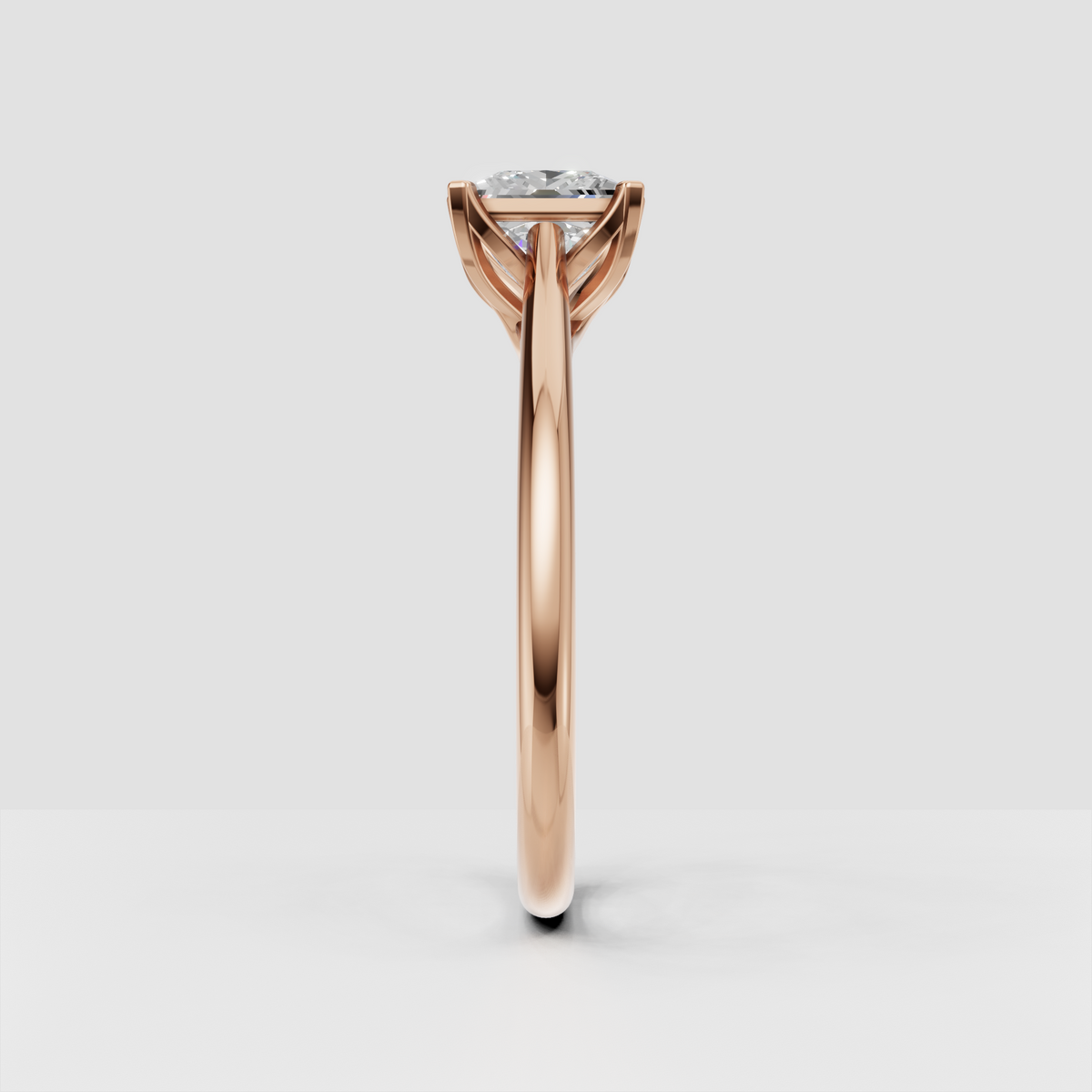Princess cut diamond ring with curved gold setting