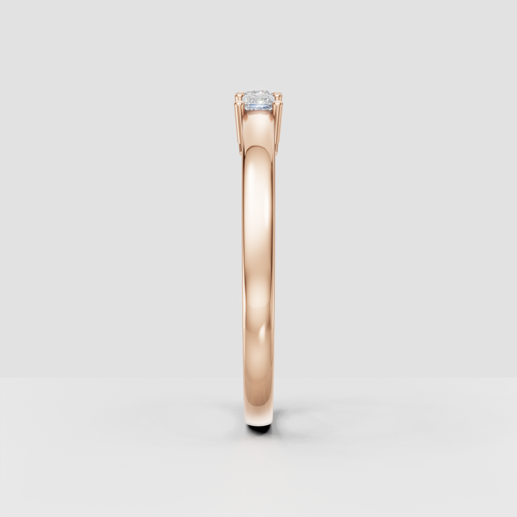 Side view of a yellow gold princess cut diamond five-stone ring