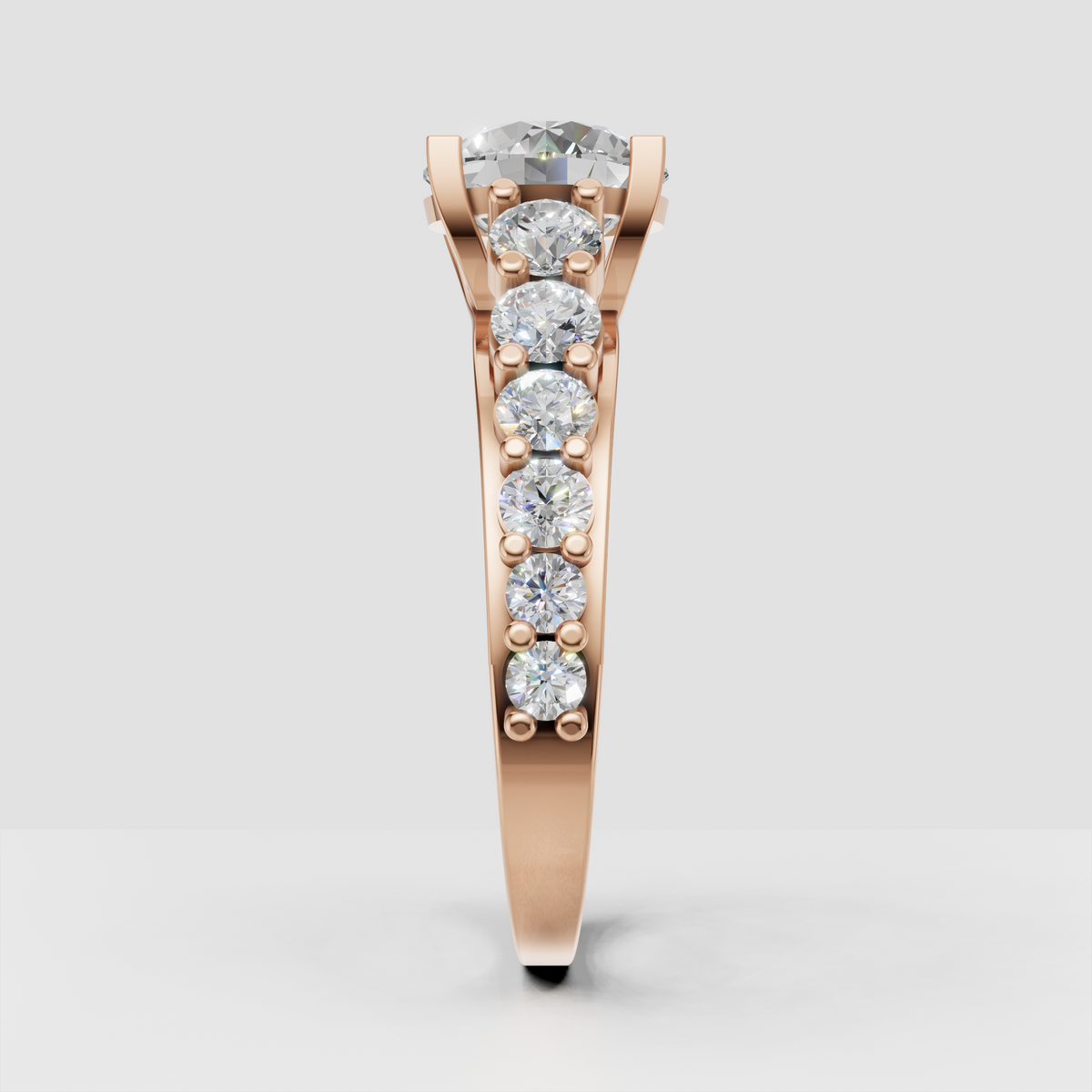 Round diamond cluster engagement ring in polished yellow gold