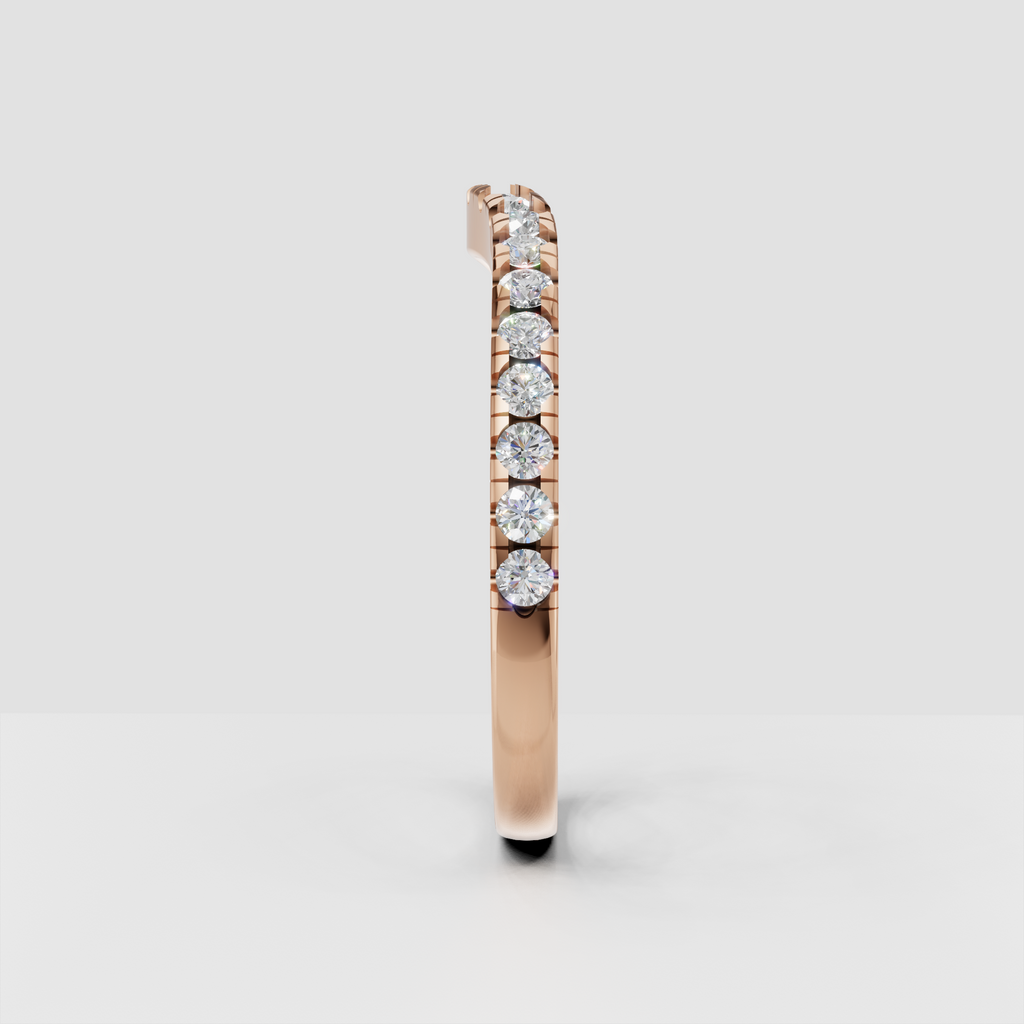 Round diamond pavé ring photographed from an angled view