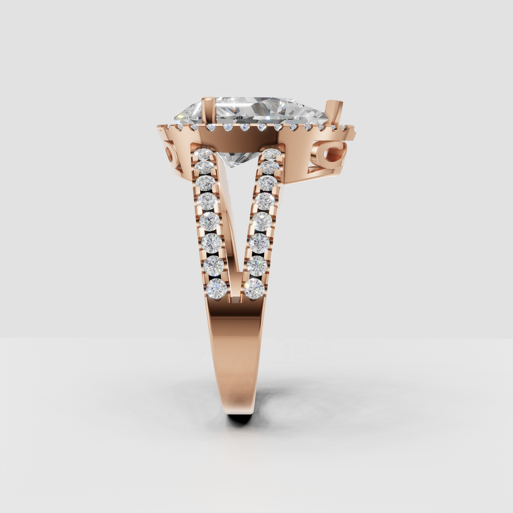 Pear cut diamond halo ring with sparkling shoulder accents