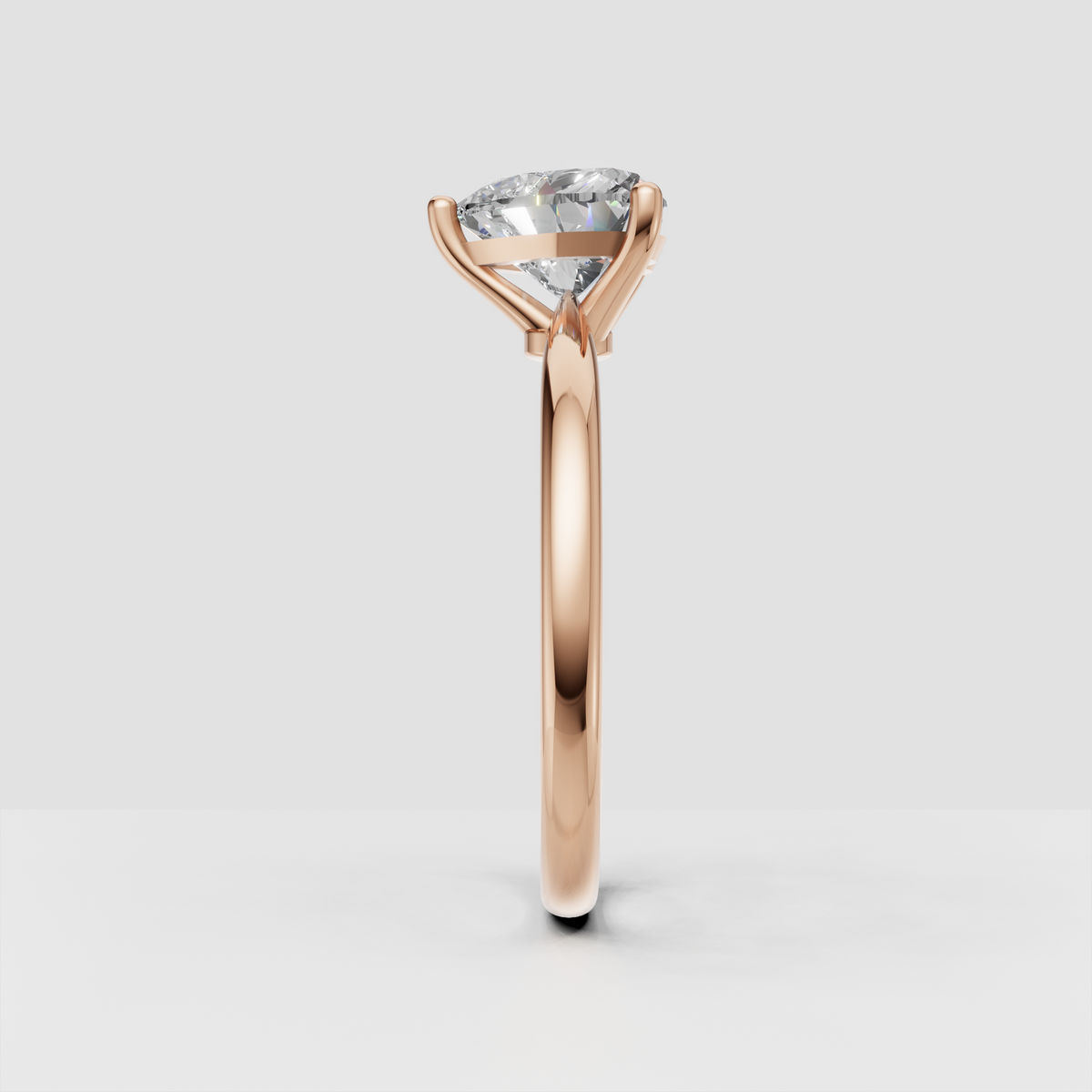 Heart shaped diamond ring featuring a polished yellow gold solitaire band