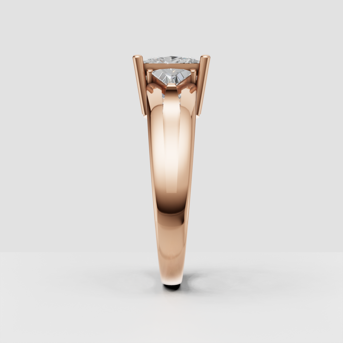 Side view of princess cut diamond ring with elevated prong setting