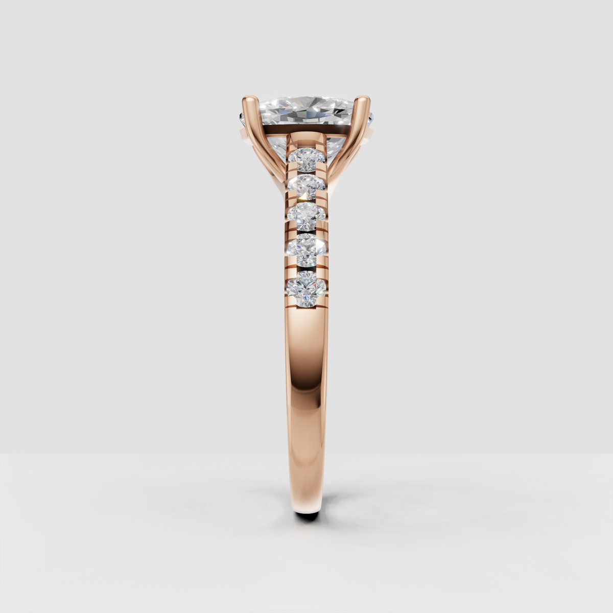 Cushion cut solitaire engagement ring with four prongs