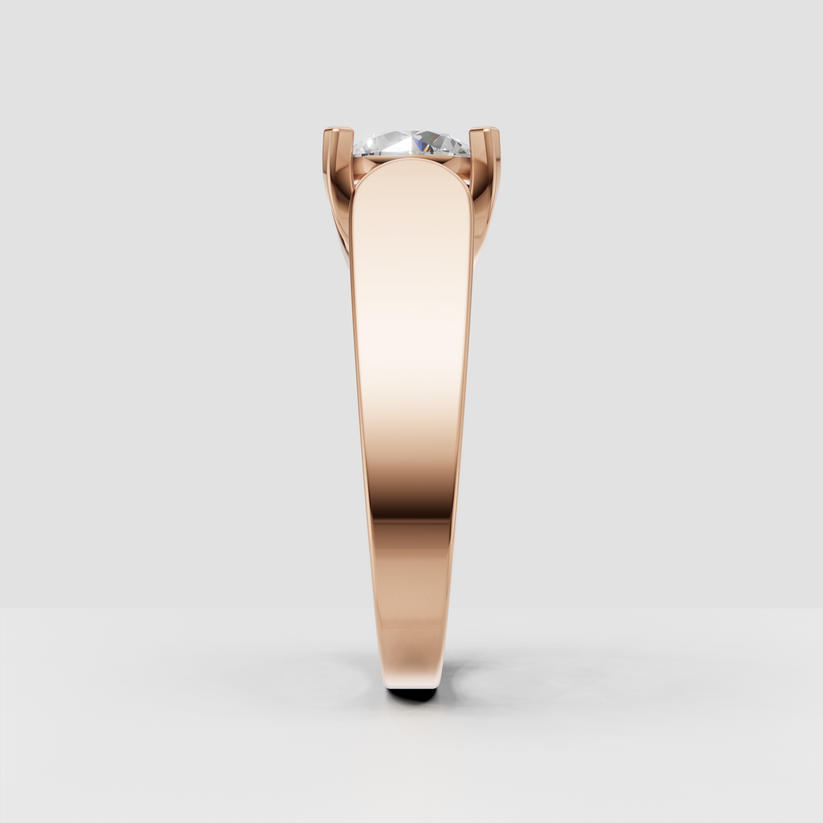 Round cut diamond ring featuring a bezel-style center and four prong accents