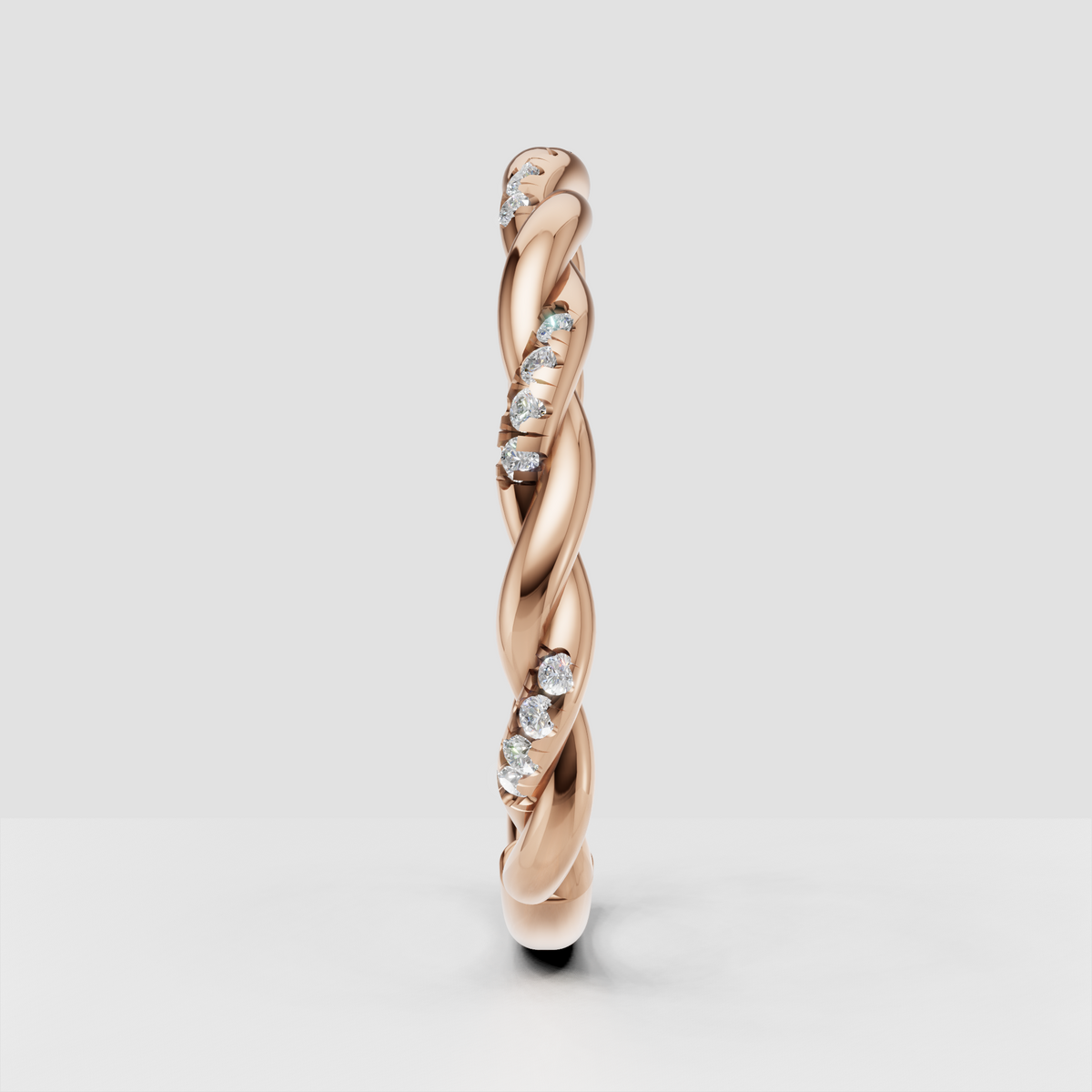 Interwoven gold wedding band with round diamonds