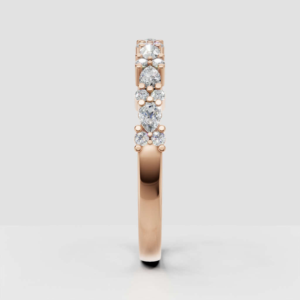 Pear and round diamond anniversary ring