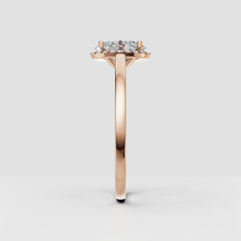 Four-prong yellow gold oval diamond ring viewed from the front
