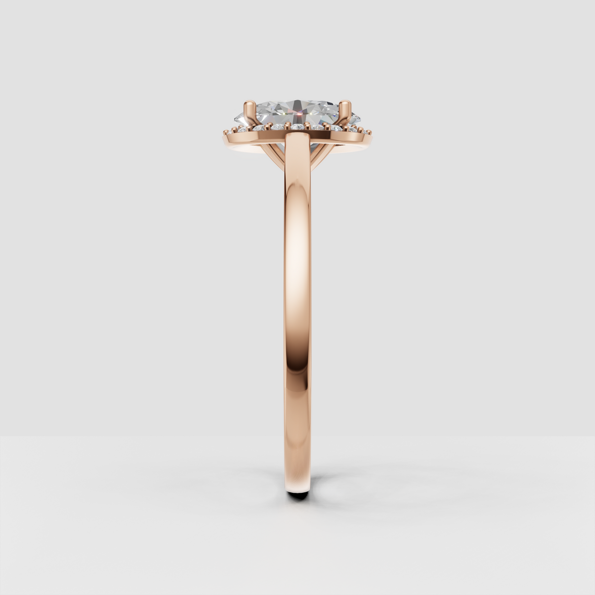 Four-prong yellow gold oval diamond ring viewed from the front