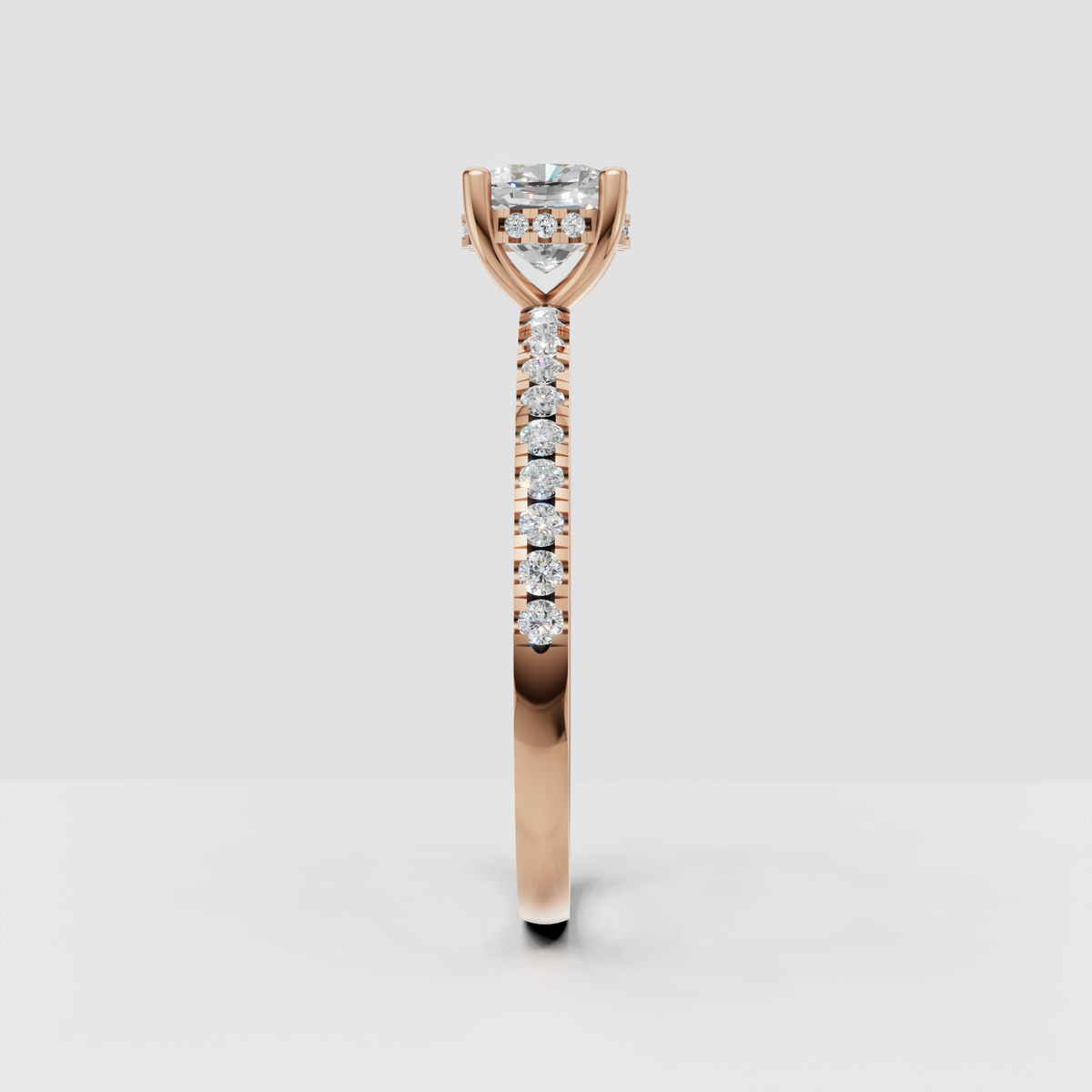 Cushion engagement ring with concealed halo and continuous pave detailing