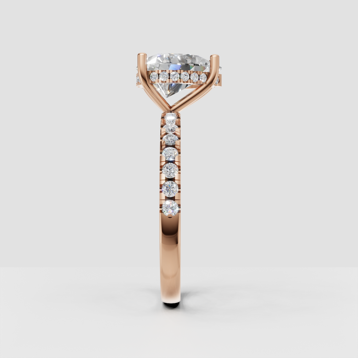 Pear diamond center stone secured by four-prong style setting