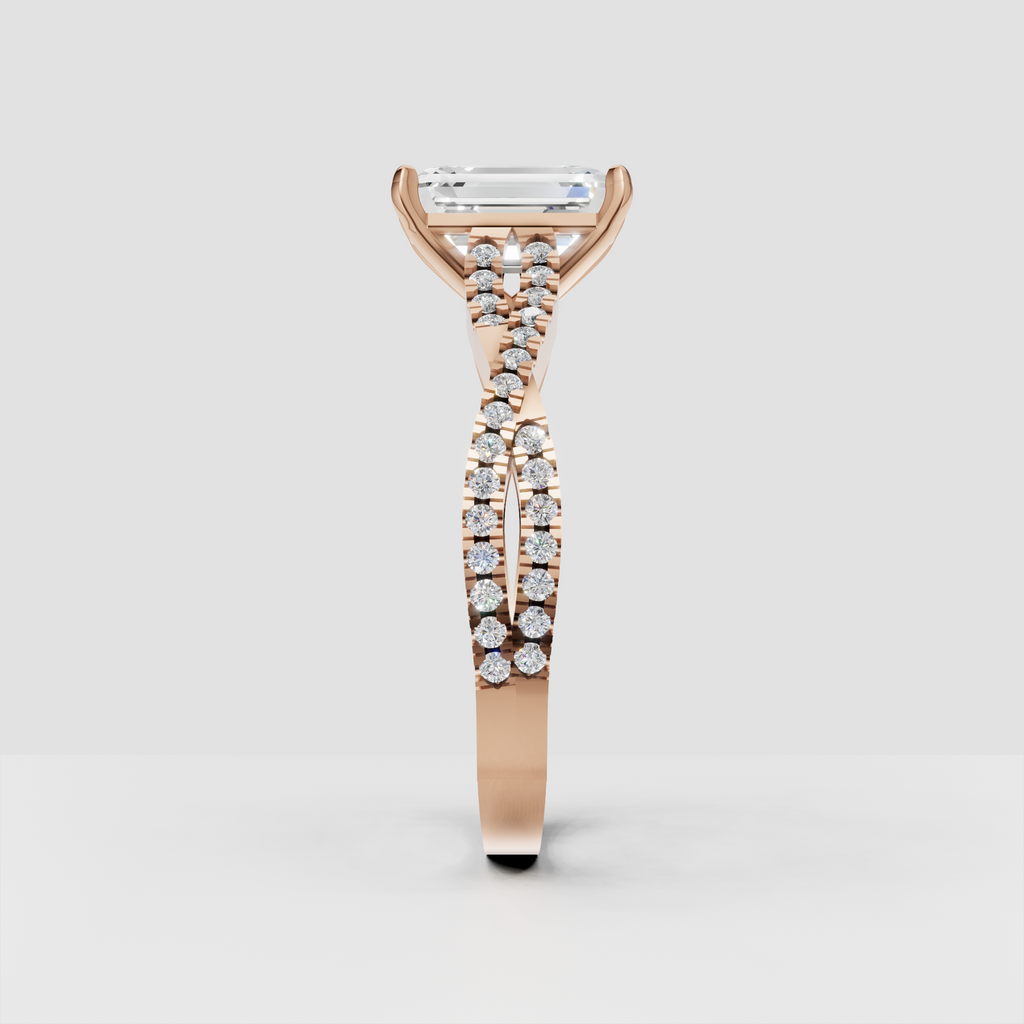 Side view of emerald cut diamond cathedral engagement ring