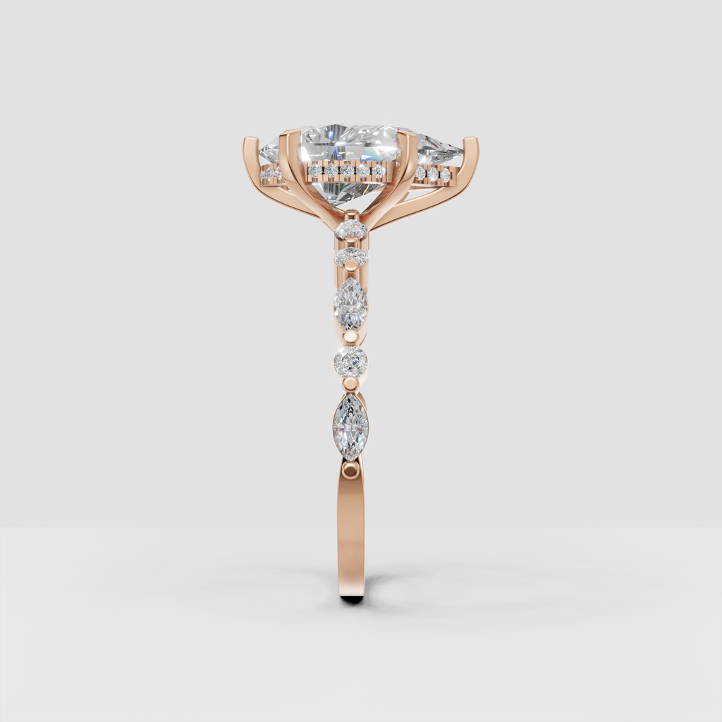 Side view of marquise diamond engagement ring in yellow gold
