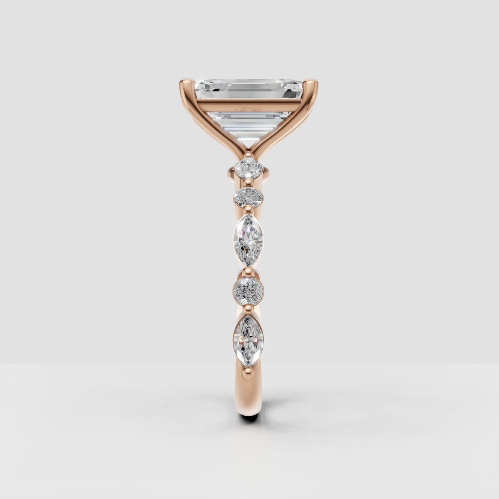 Front view of emerald cut diamond engagement ring with side stones