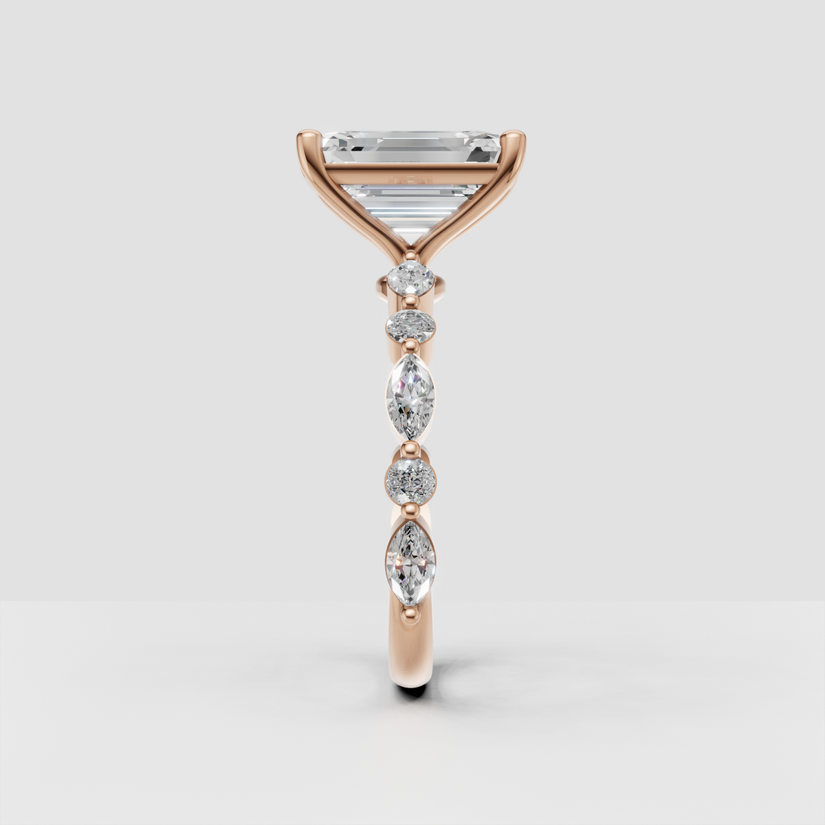 Front view of emerald cut diamond engagement ring with side stones