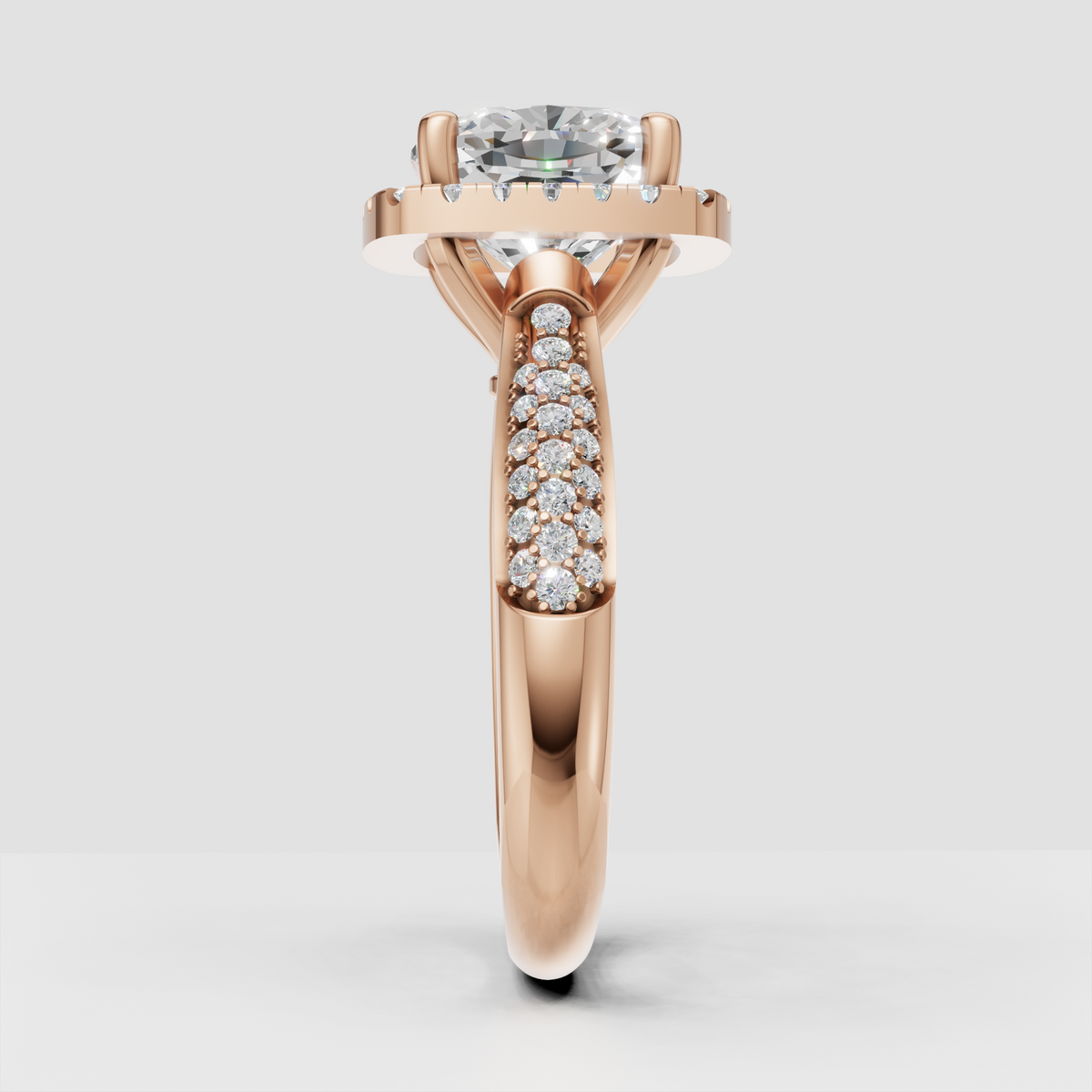 Cushion halo engagement ring with intricate pavé shoulder detailing