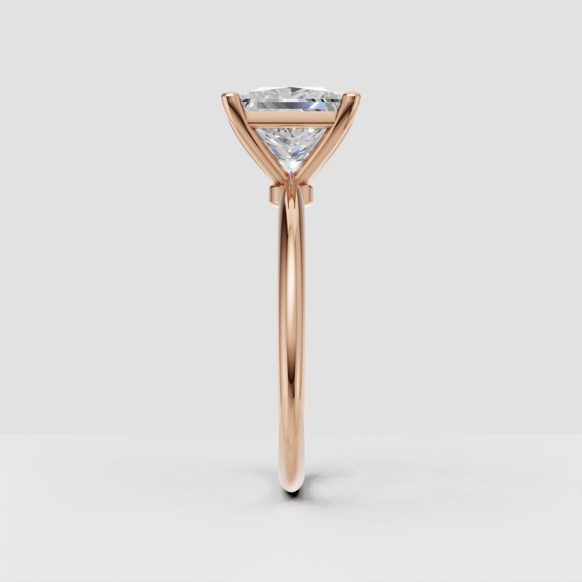 Close-up princess cut diamond solitaire ring showing brilliant faceted center stone