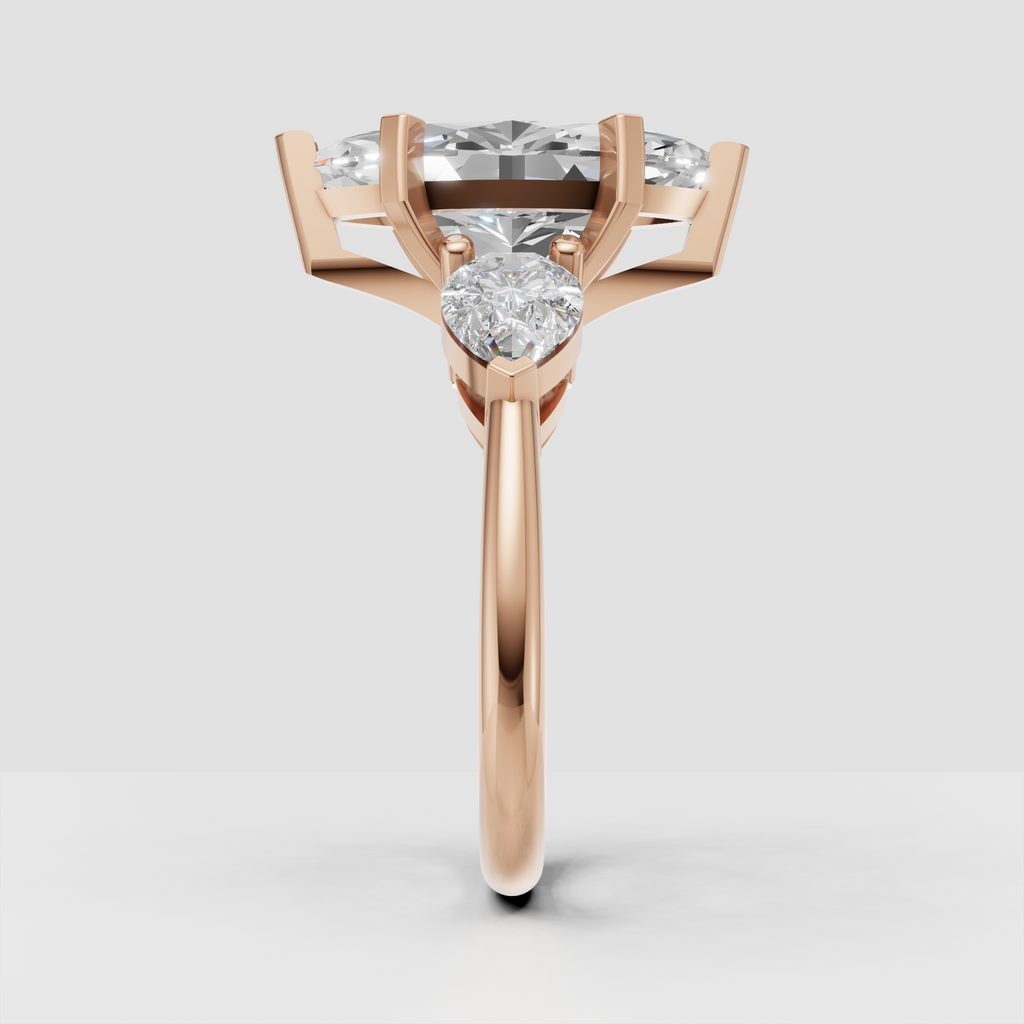 Sophisticated marquise three stone bridal ring with pear diamonds