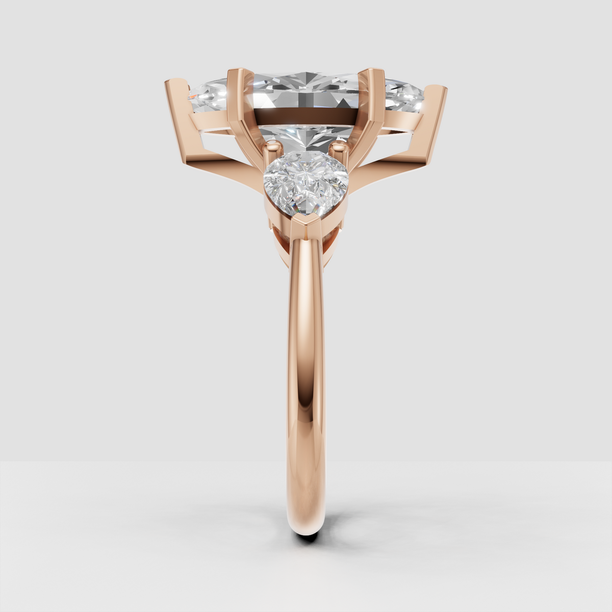 Sophisticated marquise three stone bridal ring with pear diamonds