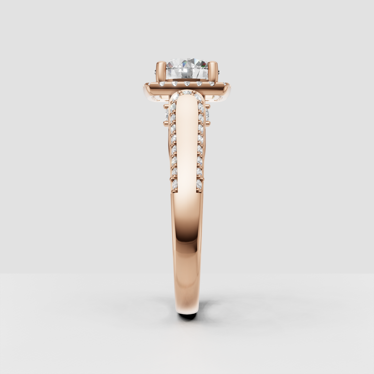 Detailed halo engagement ring with round brilliant center stone in yellow gold