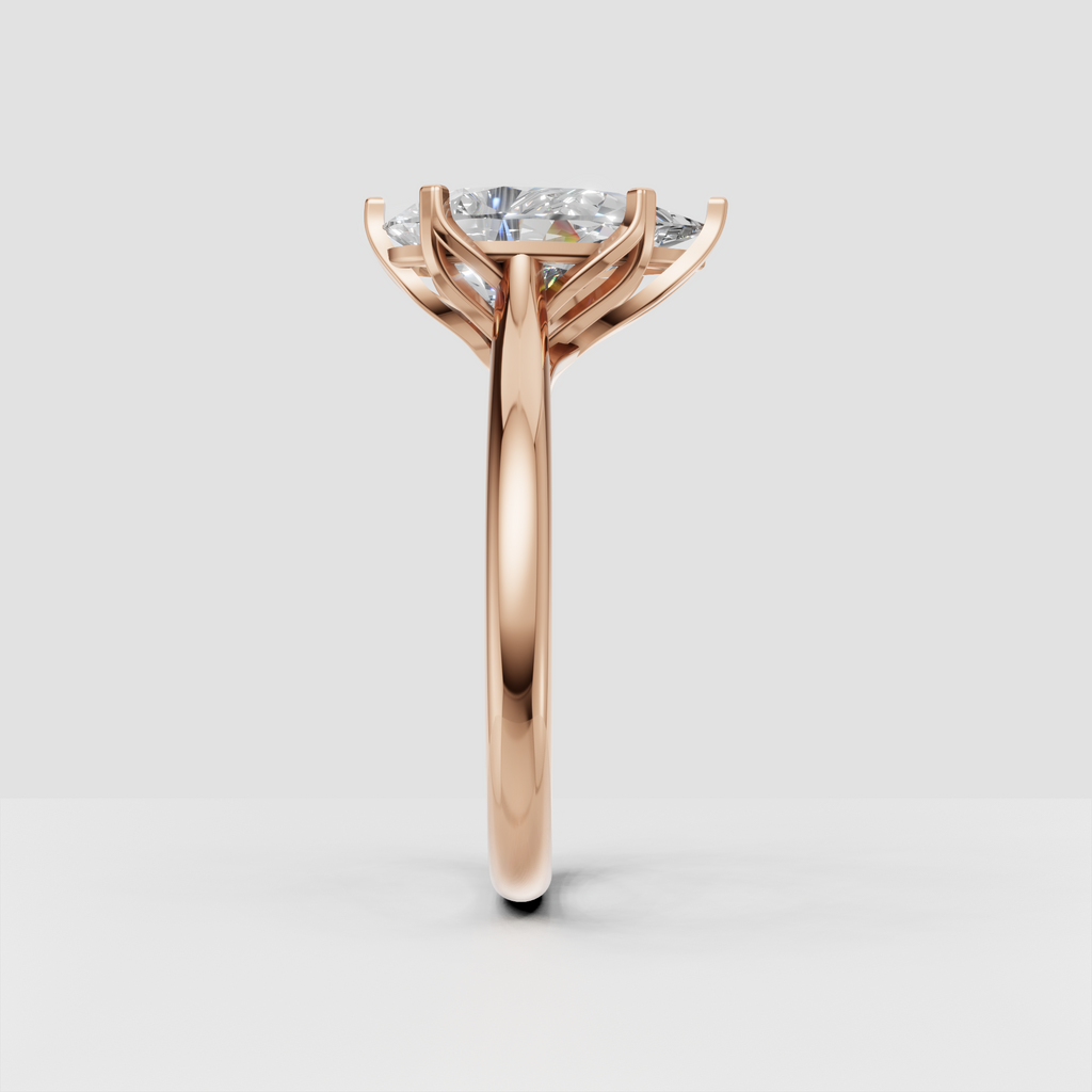 Close-up pear-shaped diamond engagement ring in yellow gold